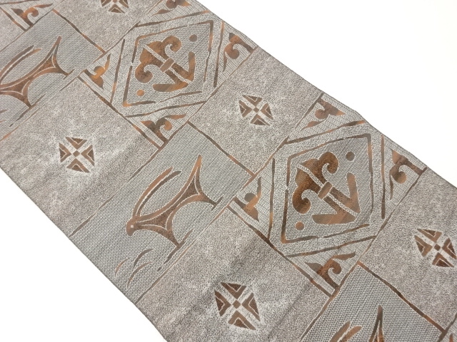 本場筑前博多格子に動物・幾何学模様織出し名古屋帯